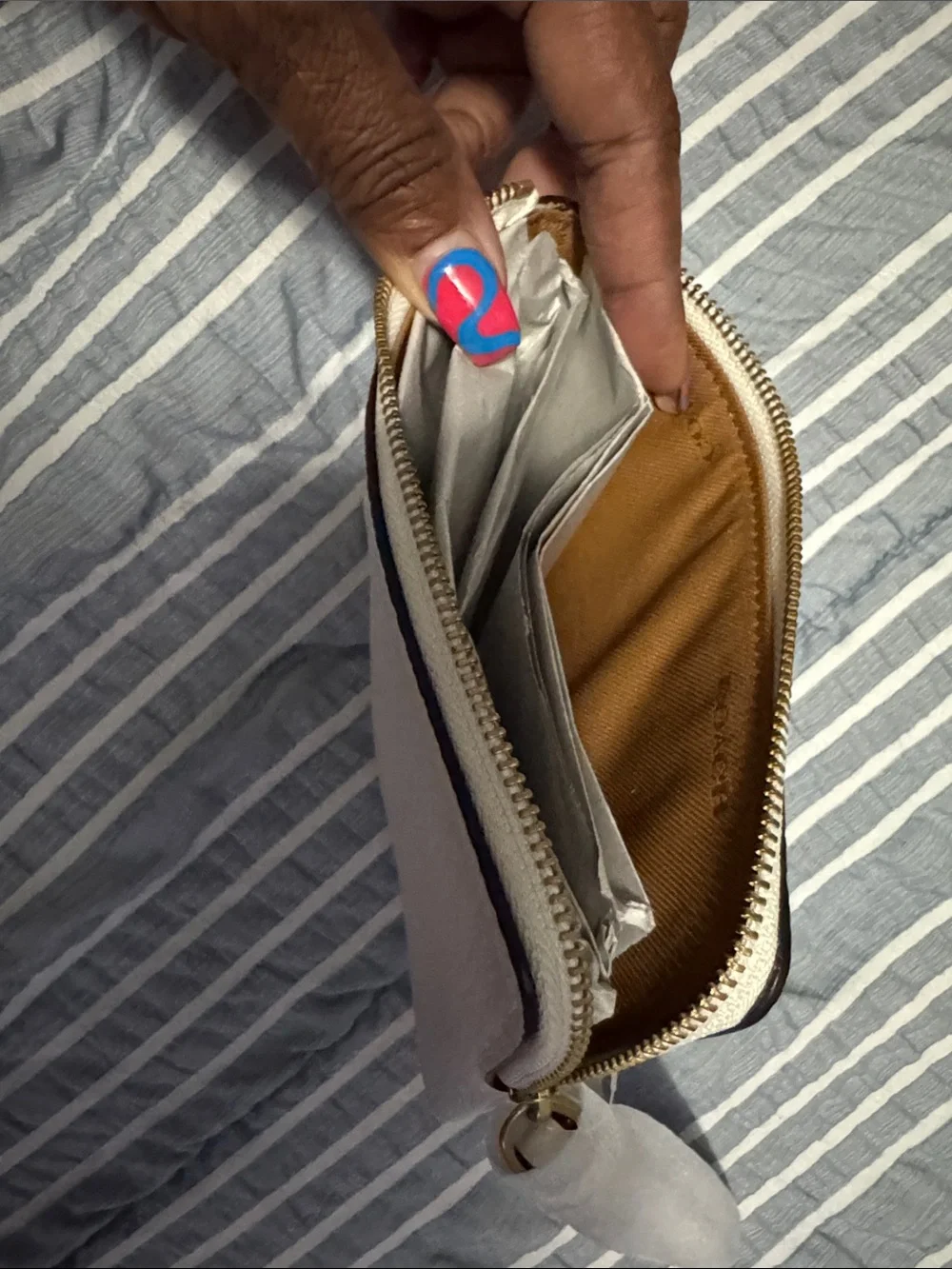 COACH Cream Pebbled Leather Wristlet Clutch with Gold Logo